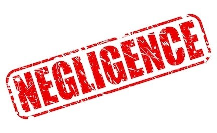 sign that says "negligence" in red stamp letters