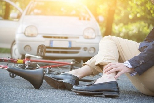 person on the ground after a car accident 