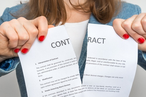 Woman ripping up a contract