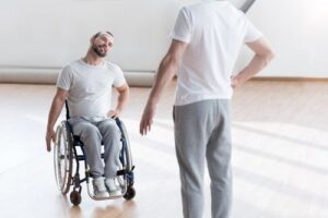Man in wheelchair getting therapy