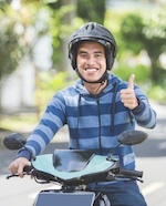 Biker with a thumbs up. He has a class M license to drive motorcycles in Nevada.