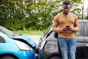 Man calling for help following a car accident
