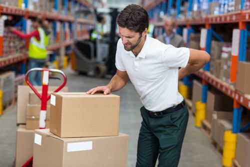 warehouse worker clutching his back in pain