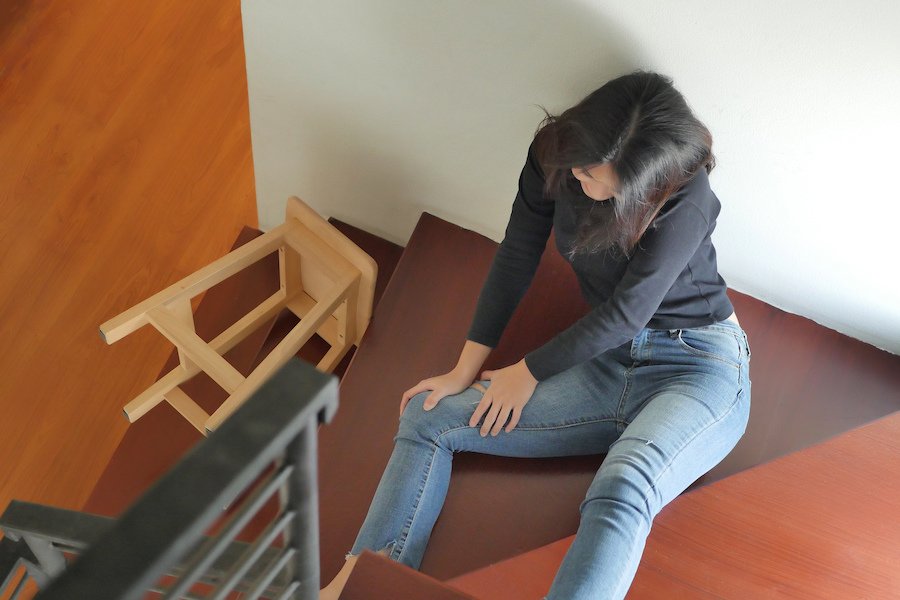 Woman on stairs following a fall