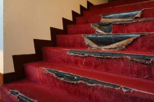 Torn carpeting on a staircase 