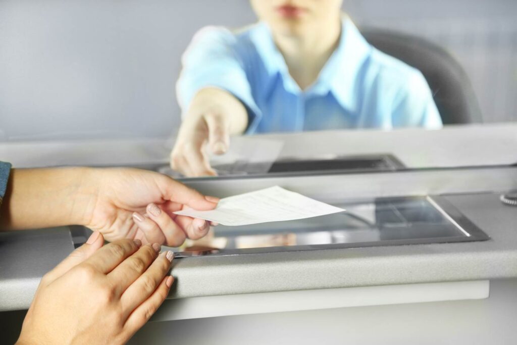 Plaintiff depositing check at bank - Structured settlements in Nevada provide plaintiffs with money over time rather than a lump-sum upfront